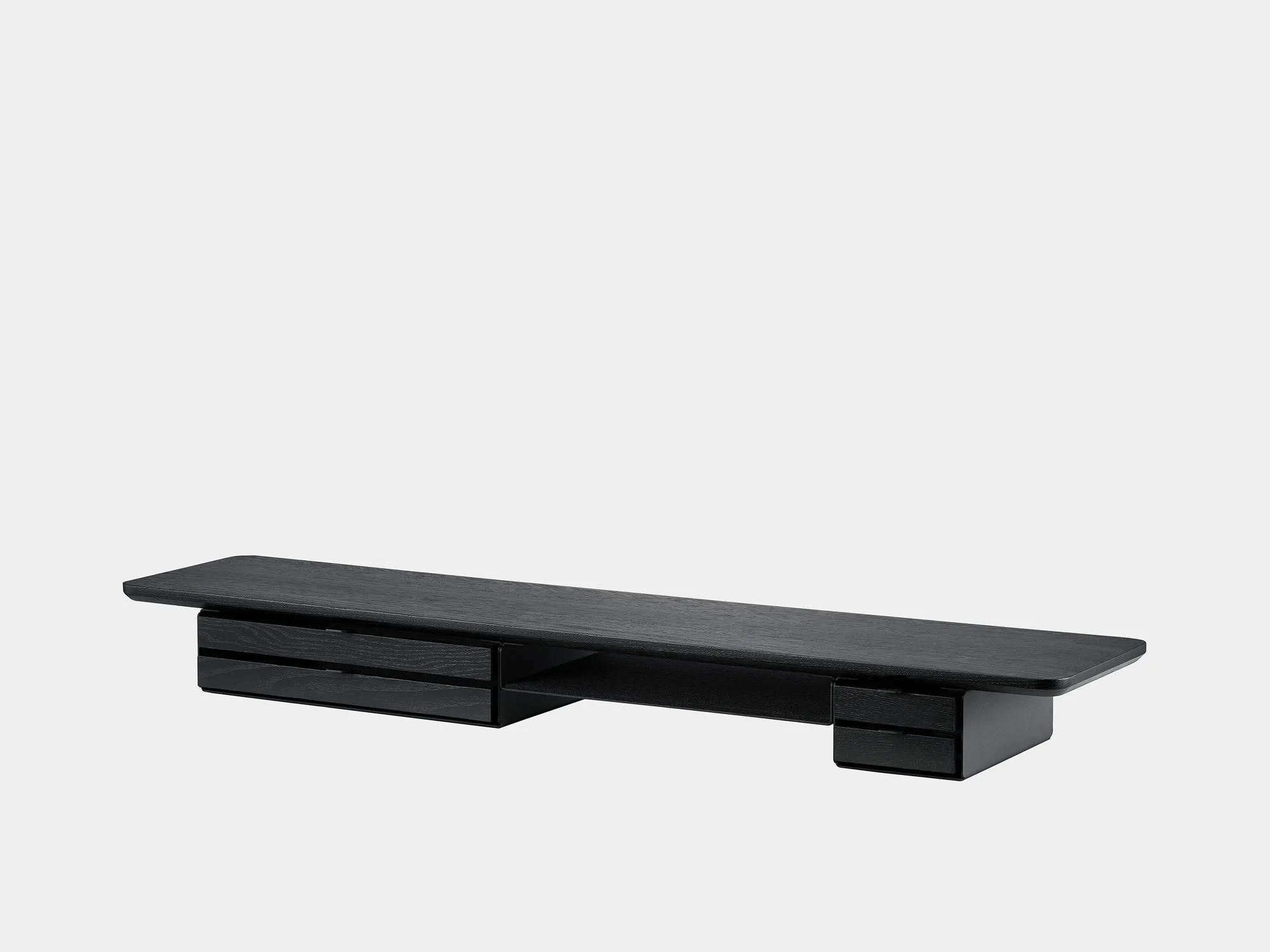 Black Deskshelf Pro on a grey background