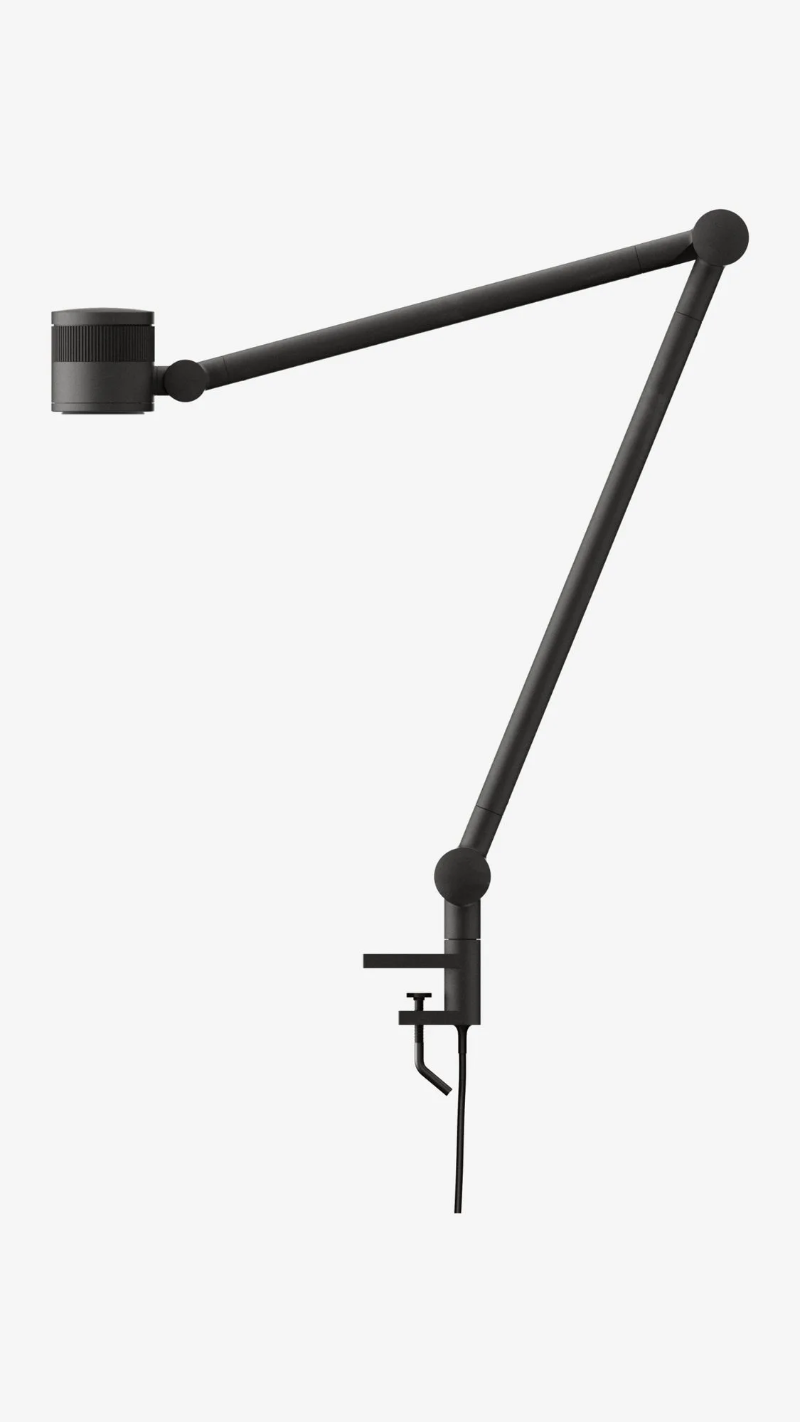 FOCAL lamp clamped to a desk edge, full view of the articulated arm