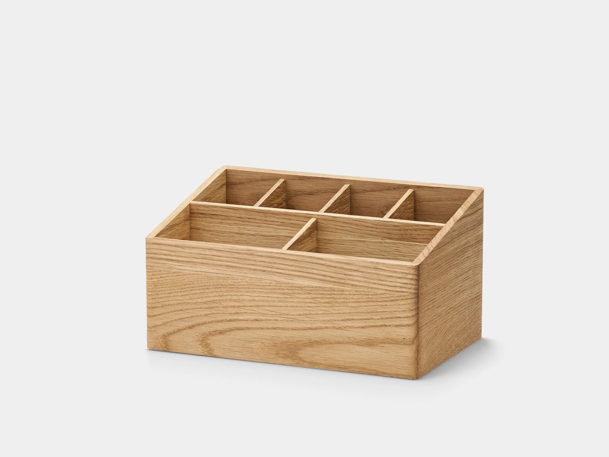 Oak organiser with compartments on a grey background