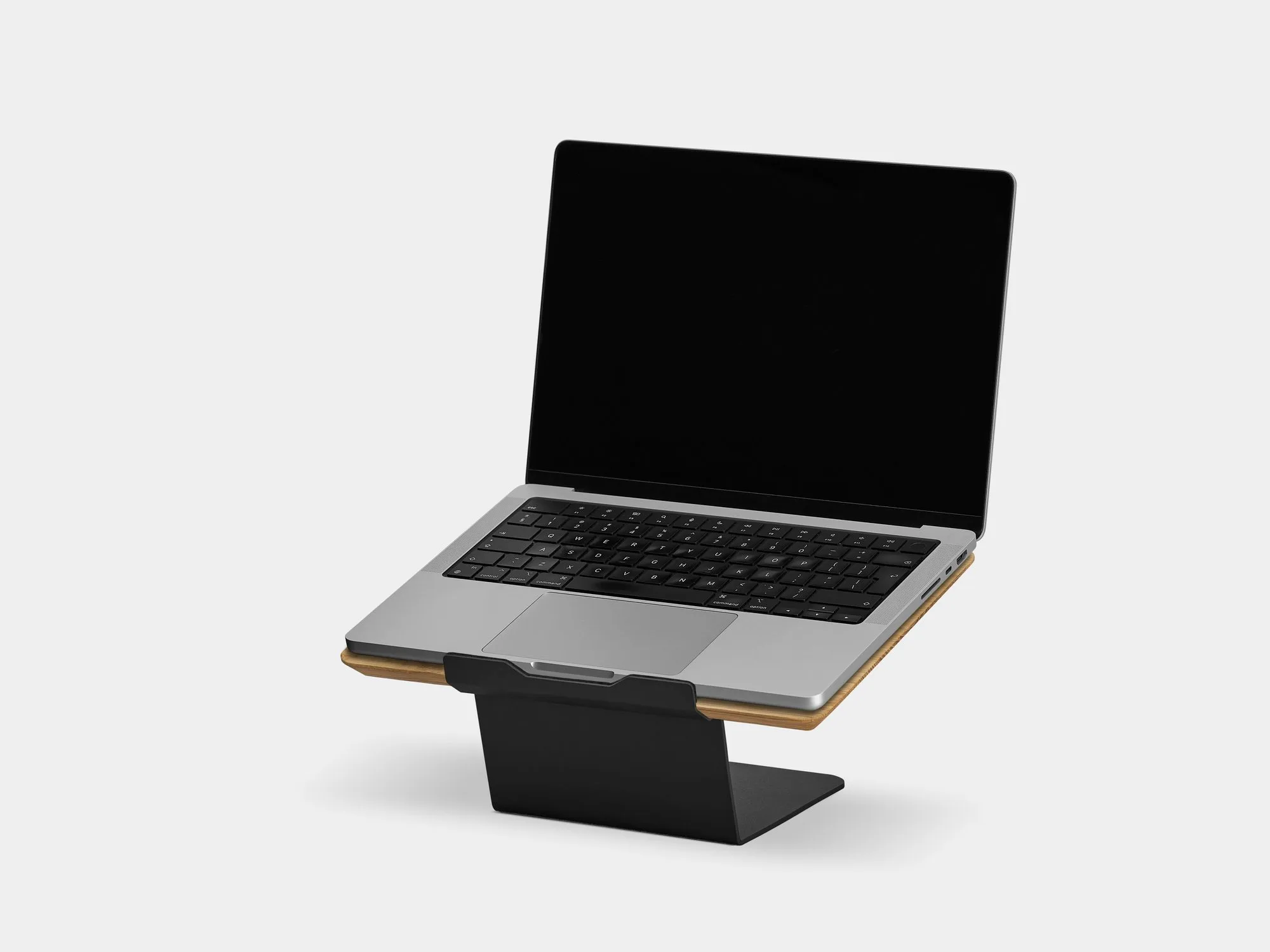 Laptop on a riser on a grey background