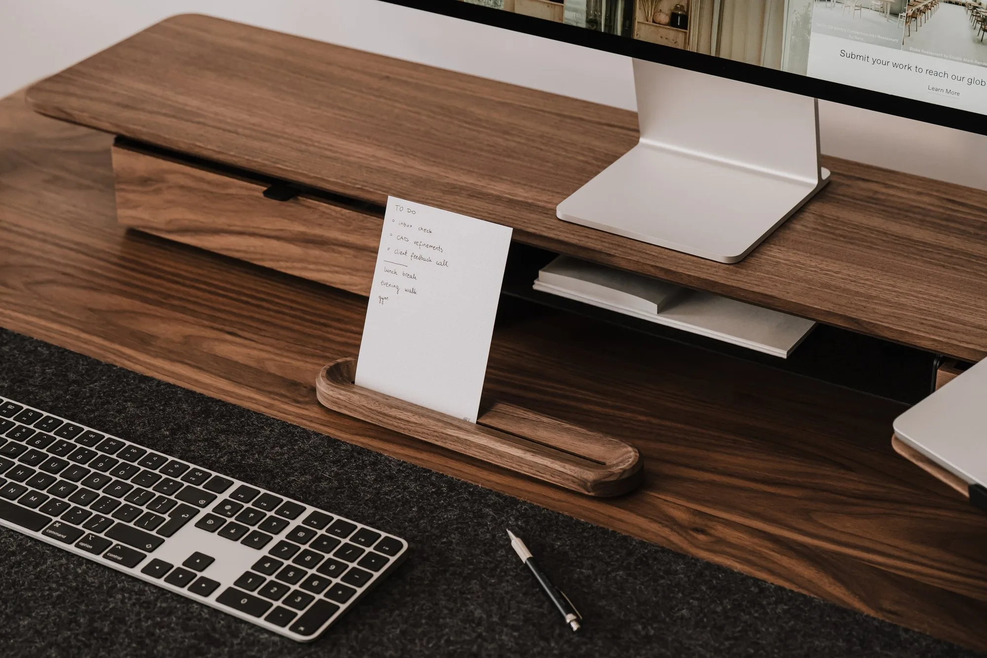 Walnut card holder with a to-do card on a walnut desk