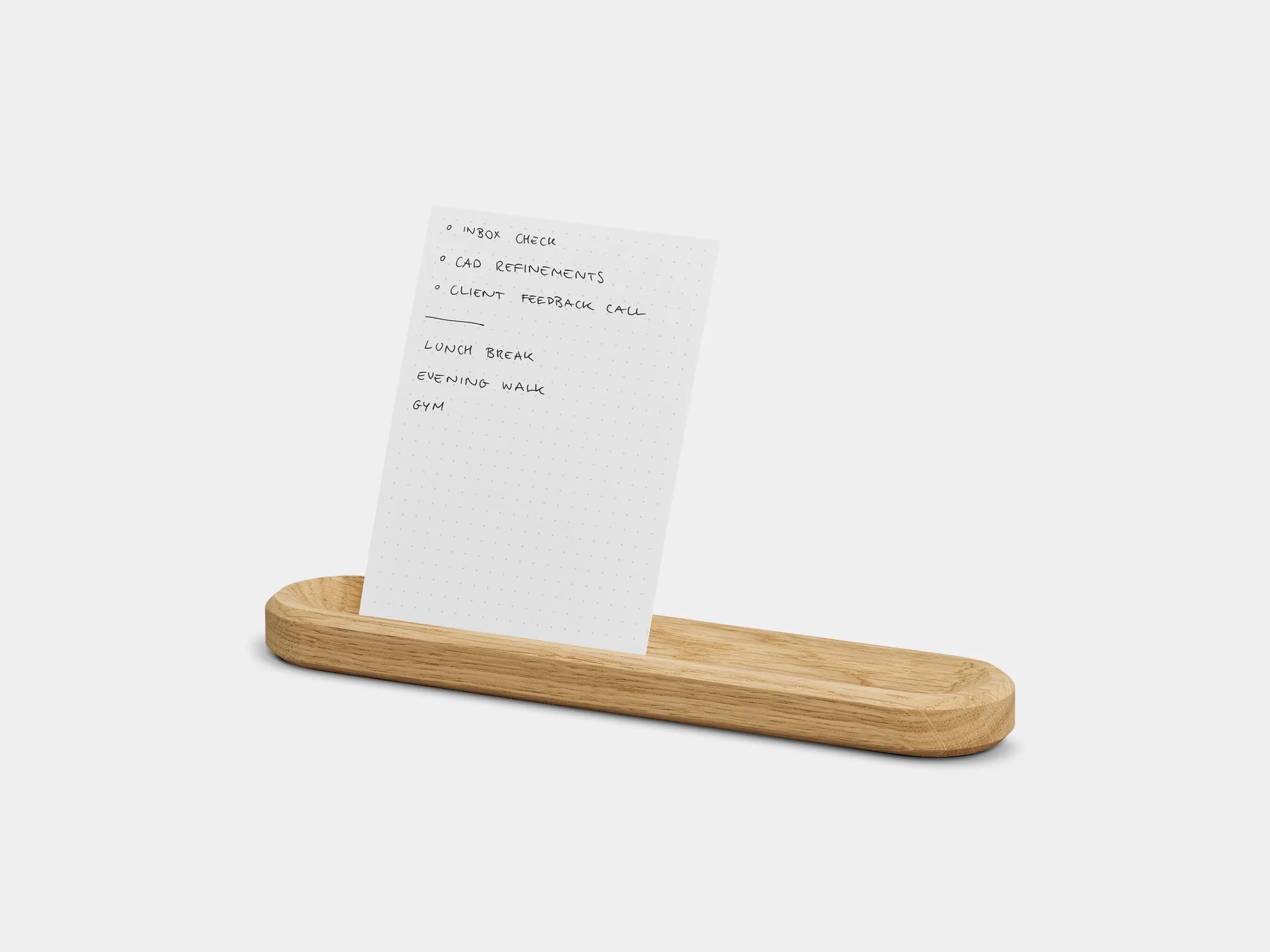 Oak card holder with a card on a grey background
