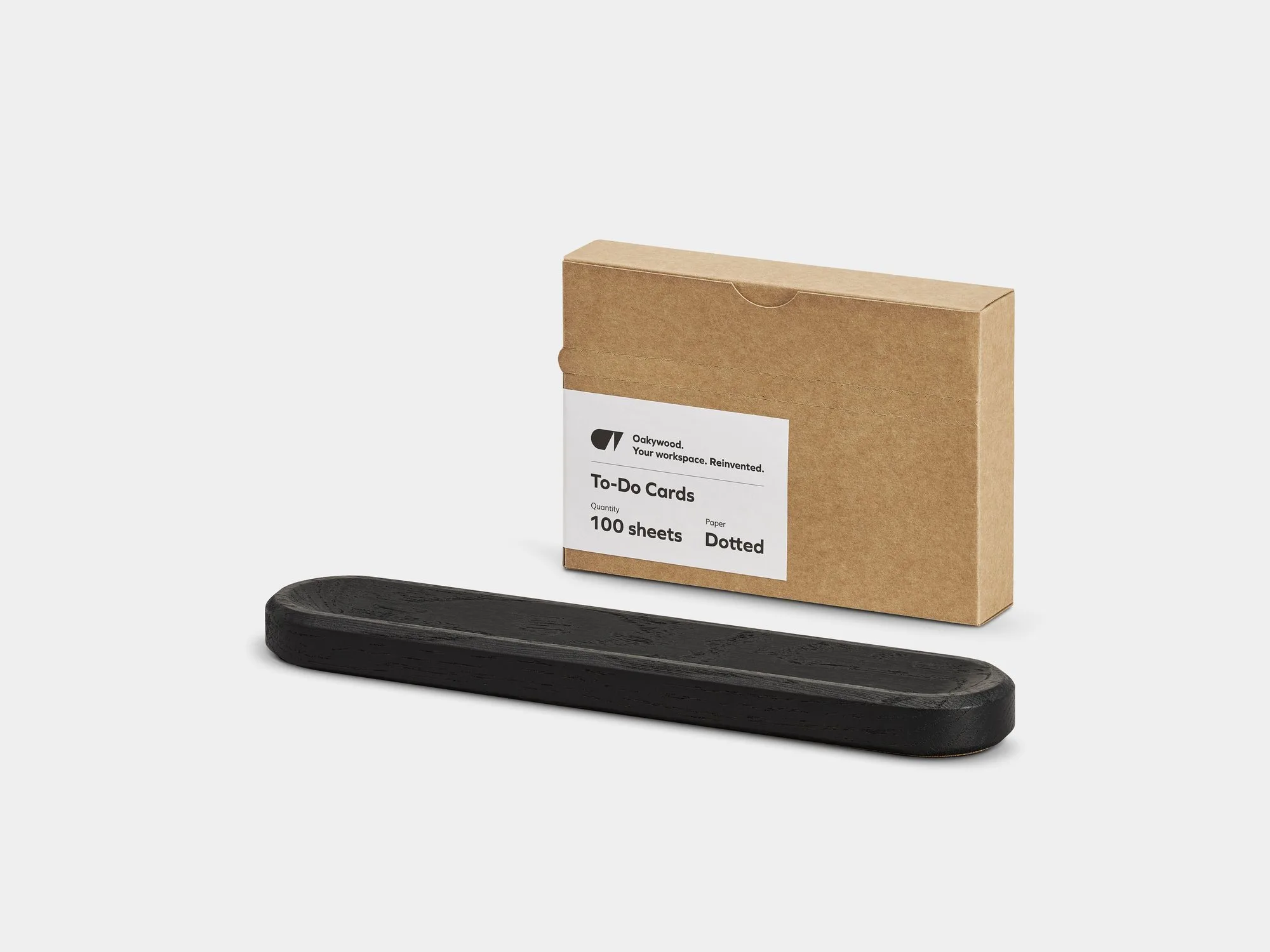 Black card holder and a box of cards on a grey background